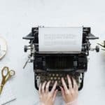 freelance writing hands on typewriter