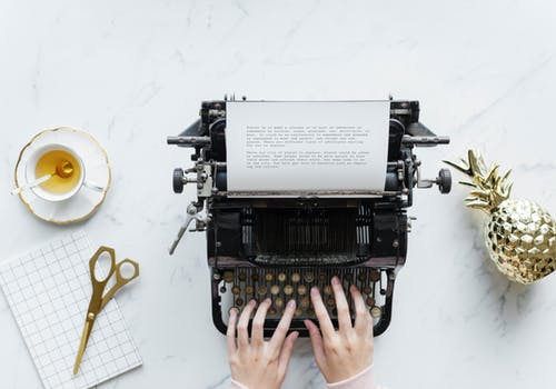 freelance writing hands on typewriter